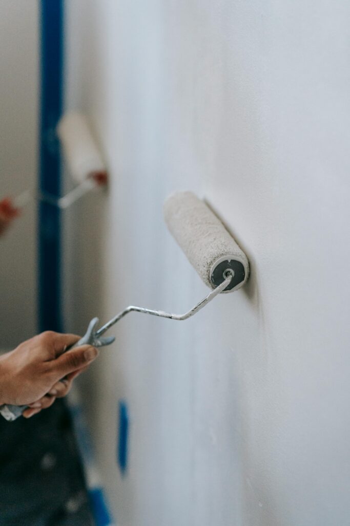 A wall being painted with a paint roller
